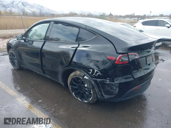 2023 Tesla Model Y Long Range with VIN 7SAYGDEE5PF766685, listed as a IAAI auction lot 41933729 with 25,959 mi miles and . Bid and sale history available at DreamBid. Image 3.