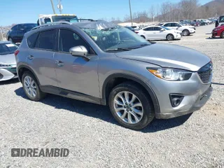 2014 Mazda CX-5 Grand Touring with VIN JM3KE4DY3E0368169, listed as a IAAI auction lot 41857976 with 127,853 mi miles. Bid and sale history available at carsss.com. Image 1.