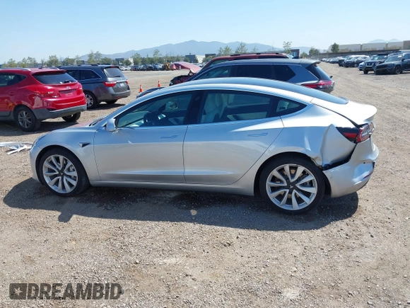 2018 Tesla Model 3 Long Range Battery with VIN 5YJ3E1EB5JF100578, listed as a IAAI auction lot 41959766 with 57,931 mi miles and . Bid and sale history available at DreamBid. Image 14.