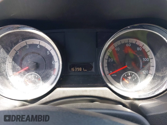 2013 Dodge Grand Caravan SE with VIN 2C4RDGBG0DR702913, listed as a IAAI auction lot 42007786 with 163,981 mi miles and . Bid and sale history available at DreamBid. Image 7.
