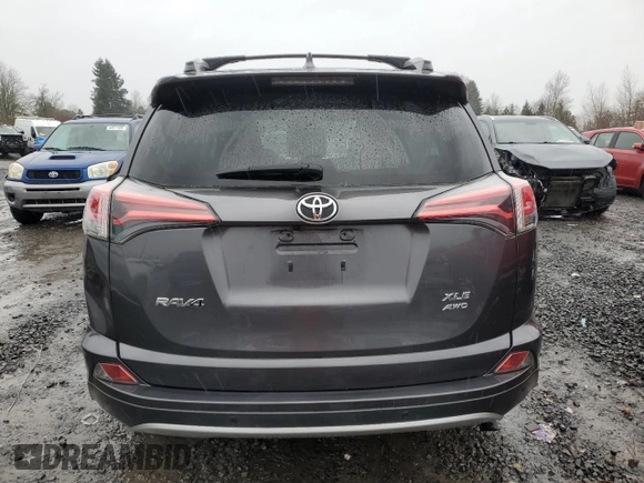 2018 Toyota RAV4 XLE with VIN JTMRFREV0JJ200337, listed as a Copart auction lot 84901594 with 57,301 mi miles and Salvage Title. Bid and sale history available at DreamBid. Image 6.