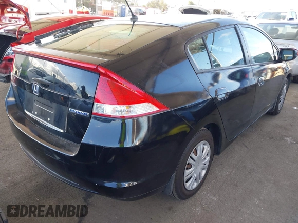 2010 Honda Insight LX with VIN JHMZE2H54AS021815, listed as a IAAI auction lot 42259951 with 137,436 mi miles and . Bid and sale history available at DreamBid. Image 4.