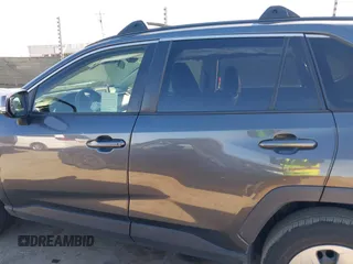 2019 Toyota RAV4 LE with VIN JTMG1RFV3KD025974, listed as a IAAI auction lot 41879264 with 131,933 mi miles and . Bid and sale history available at DreamBid. Image 14.