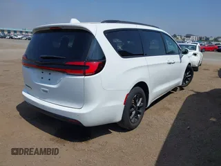2021 Chrysler Pacifica Touring with VIN 2C4RC1FG7MR605587, listed as a IAAI auction lot 42329028 with 111,305 mi miles and . Bid and sale history available at DreamBid. Image 4.