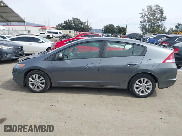 2012 Honda Insight EX z VIN JHMZE2H73CS000751, wystawiony jako IAAI lot #41687288 z przebiegiem 181 593 mil mil oraz . Historia ofert i sprzedaży dostępna na DreamBid. Obrazek 14.