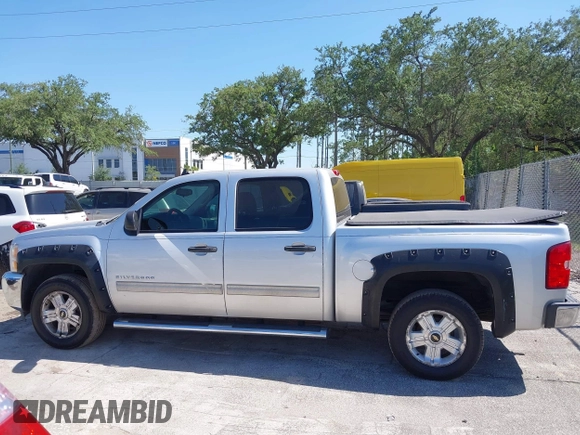 2013 Chevrolet Silverado 1500 LT with VIN 3GCPKSE71DG203443, listed as a IAAI auction lot 42033447 with 128,904 mi miles. Bid and sale history available at carsss.com. Image 14.