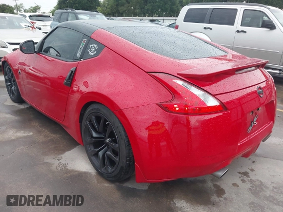 2016 Nissan 370Z z VIN JN1AZ4EHXGM932681, wystawiony jako IAAI lot #42350850 z przebiegiem 94 586 mil mil oraz . Historia ofert i sprzedaży dostępna na DreamBid. Obrazek 3.
