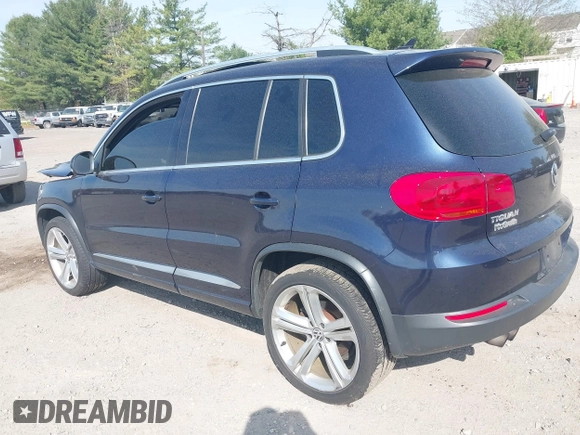 2014 Volkswagen Tiguan S z VIN WVGBV3AX7EW545538, wystawiony jako IAAI lot #42083281 z przebiegiem 129 227 mil mil oraz . Historia ofert i sprzedaży dostępna na DreamBid. Obrazek 3.