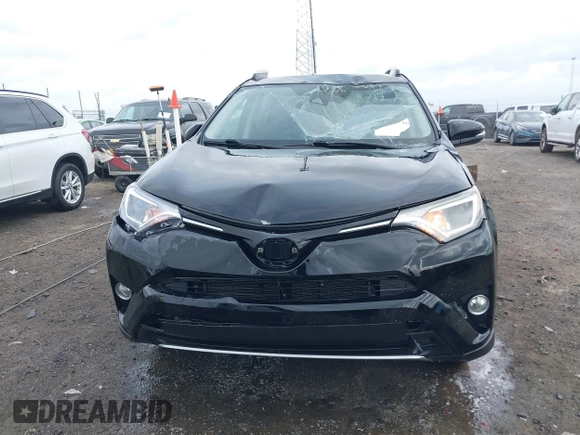 2018 Toyota RAV4 XLE with VIN 2T3WFREV9JW412755, listed as a IAAI auction lot 41889960 with 216,451 mi miles and . Bid and sale history available at carsss.com. Image 12.