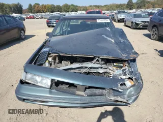 1996 Oldsmobile Cutlass Ciera 1SA VX5 z VIN 1G3AJ55M2T6328418, wystawiony jako Copart lot #77411634 z przebiegiem 29 918 mil mil oraz Szkody całkowita. Historia ofert i sprzedaży dostępna na DreamBid. Obrazek 5.