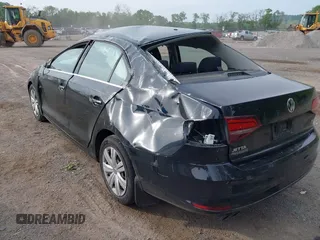 2017 Volkswagen Jetta S z VIN 3VW2B7AJ6HM345400, wystawiony jako IAAI lot #42297120 z przebiegiem 158 923 mil mil oraz . Historia ofert i sprzedaży dostępna na DreamBid. Obrazek 13.