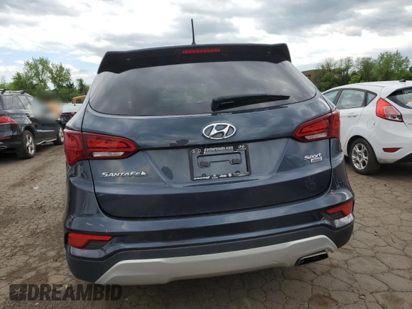 2018 Hyundai Santa Fe 2.4L z VIN 5NMZTDLB4JH066703, wystawiony jako Copart lot #54432155 z przebiegiem 67 737 mil mil oraz Szkoda całkowita • Salvage title. Historia ofert i sprzedaży dostępna na DreamBid. Obrazek 6.