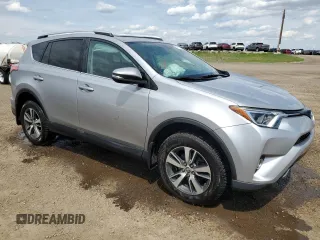 2016 Toyota RAV4 XLE with VIN 2T3RFREV9GW439315, listed as a Copart auction lot 59704345 with 143,198 mi miles and Salvage title. Bid and sale history available at DreamBid. Image 4.