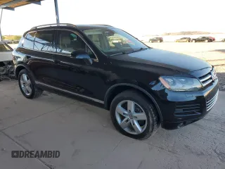 2011 Volkswagen Touareg с VIN WVGFG9BP2BD003056, выставлен на аукционе Copart как лот 84203674 с пробегом 171 456 миль миль и Списание • Salvage title. История ставок и продаж доступна на DreamBid. Изображение 4.