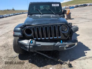 2023 Jeep Wrangler Sahara with VIN 1C4JJXP65PW661194, listed as a Copart auction lot 55729925 with 24,264 mi miles and Clean Title. Bid and sale history available at DreamBid. Image 5.