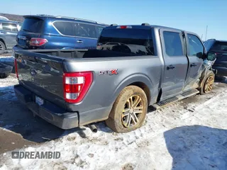 2021 Ford F-150 XL z VIN 1FTEW1C51MFC94173, wystawiony jako IAAI lot #41628222 z przebiegiem 23 266 mil mil oraz . Historia ofert i sprzedaży dostępna na DreamBid. Obrazek 4.