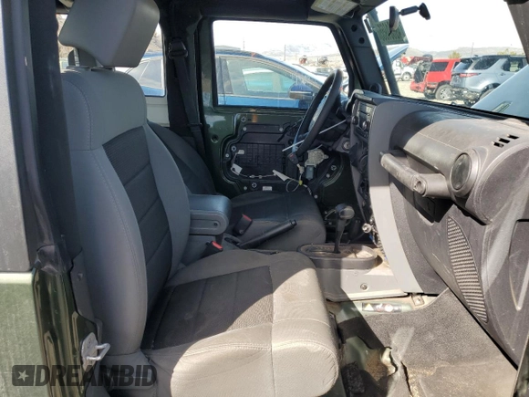 2009 Jeep Wrangler X with VIN 1J4FA24169L707695, listed as a Copart auction lot 49861955 with 89,807 mi miles and Salvage Title. Bid and sale history available at DreamBid. Image 7.