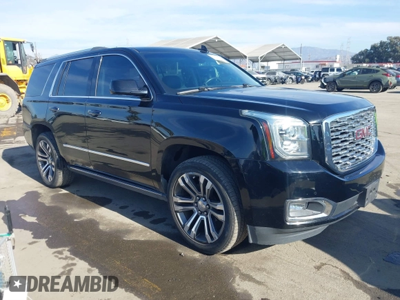 2019 GMC Yukon Denali with VIN 1GKS2CKJ4KR191886, listed as a IAAI auction lot 41198227 with 74,325 mi miles. Bid and sale history available at carsss.com. Image 1.