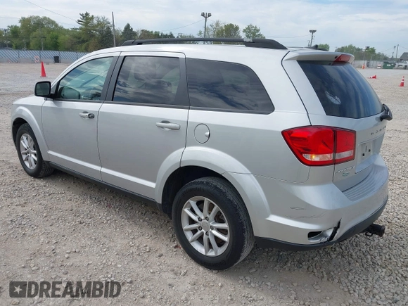 2014 Dodge Journey SXT with VIN 3C4PDCBG9ET209357, listed as a IAAI auction lot 42257467 with 121,786 mi miles and . Bid and sale history available at DreamBid. Image 3.