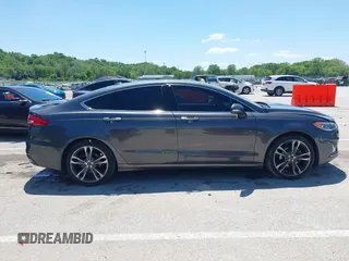 2020 Ford Fusion Titanium with VIN 3FA6P0K96LR173971, listed as a IAAI auction lot 42232469 with 82,474 mi miles and . Bid and sale history available at DreamBid. Image 14.