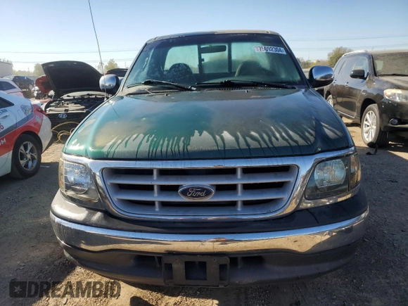 1999 Ford F-150 XL with VIN 2FTZF0720XCA14612, listed as a Copart auction lot 75092304 with 230,897 mi miles and Salvage Title. Bid and sale history available at carsss.com. Image 5.
