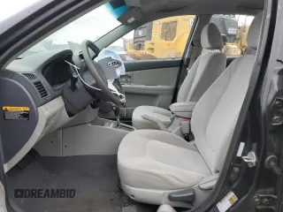 2009 Kia Spectra EX with VIN KNAFE222495648220, listed as a Copart auction lot 52886915 with 146,417 mi miles and Salvage title. Bid and sale history available at DreamBid. Image 7.