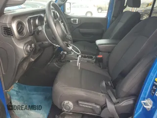 2023 Jeep Wrangler Sport S with VIN 1C4HJXDN5PW573692, listed as a Copart auction lot 42982875 with 25,584 mi miles and Salvage Title. Bid and sale history available at DreamBid. Image 7.