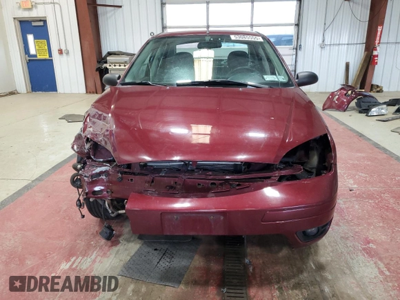 2006 Ford Focus S z VIN 1FAFP34N76W153239, wystawiony jako Copart lot #53085555 z przebiegiem 118 259 mil mil oraz Szkody całkowita. Historia ofert i sprzedaży dostępna na DreamBid. Obrazek 5.