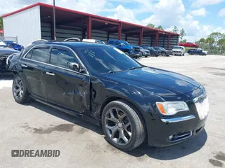 2014 Chrysler 300 C with VIN 2C3CCAKT9EH171614, listed as a IAAI auction lot 39747704 with 129,156 mi miles and . Bid and sale history available at carsss.com. Image 1.