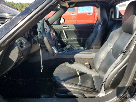 2010 Mazda MX-5 Miata Grand Touring with VIN JM1NC2FFXA0206089, listed as a Copart auction lot 76752674 with 212,584 mi miles and Salvage title. Bid and sale history available at DreamBid. Image 7.