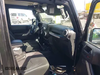 2015 Jeep Wrangler Unlimited Sahara with VIN 1C4BJWEGXFL506361, listed as a IAAI auction lot 41865418 with 80,841 mi miles. Bid and sale history available at carsss.com. Image 5.