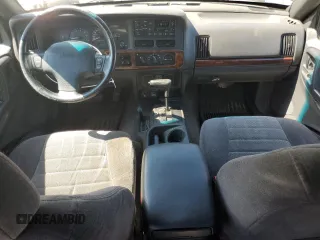 1998 Jeep Grand Cherokee Laredo z VIN 1J4GZ58S4WC278490, wystawiony jako Copart lot #62388535 z przebiegiem 133 896 mil mil oraz Czysty tytuł • Clean title. Historia ofert i sprzedaży dostępna na DreamBid. Obrazek 8.