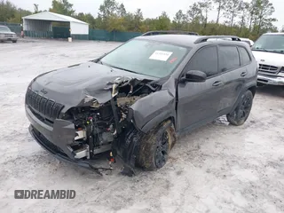 2022 Jeep Cherokee X with VIN 1C4PJMCX0ND538919, listed as a IAAI auction lot 41321416 with 65,577 mi miles. Bid and sale history available at carsss.com. Image 2.
