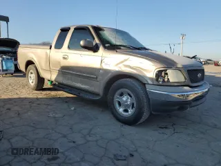 2001 Ford F-150 XL with VIN 1FTRX17L41NA96180, listed as a Copart auction lot 87309224 with 95,505 mi miles and Salvage title. Bid and sale history available at DreamBid. Image 4.