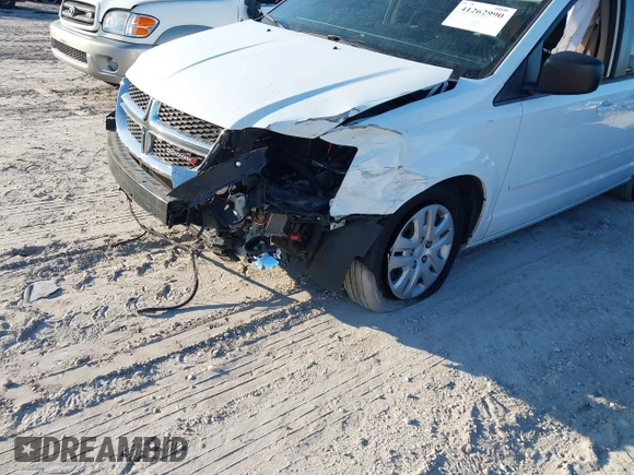 2014 Dodge Grand Caravan SE with VIN 2C4RDGBG1ER220534, listed as a IAAI auction lot 41262990 with 77,851 mi miles and . Bid and sale history available at DreamBid. Image 6.