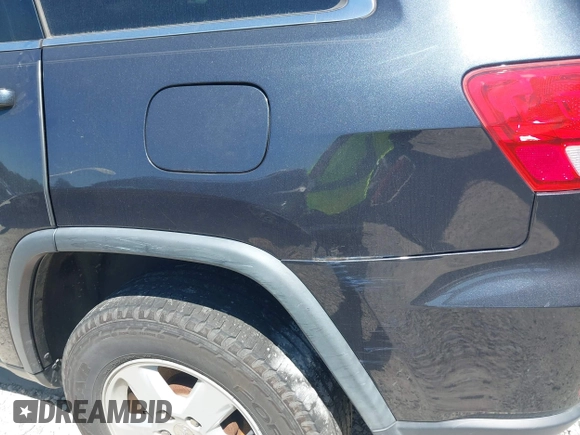2012 Jeep Grand Cherokee Laredo with VIN 1C4RJEAG9CC223167, listed as a IAAI auction lot 42136098 with 152,715 mi miles. Bid and sale history available at carsss.com. Image 17.