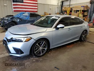 2022 Honda Civic Touring z VIN 2HGFE1F9XNH301080, wystawiony jako Copart lot #55320125 z przebiegiem 47 767 mil mil oraz Szkoda całkowita • Salvage title. Historia ofert i sprzedaży dostępna na DreamBid. Obrazek 1.