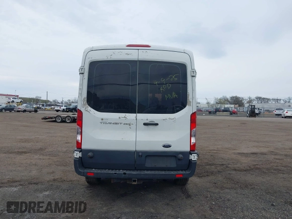 2015 Ford Transit Cargo z VIN 1FTNR2CM4FKA84584, wystawiony jako IAAI lot #42008193 z przebiegiem 224 453 mil mil oraz . Historia ofert i sprzedaży dostępna na DreamBid. Obrazek 16.