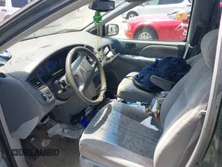2002 Toyota Sienna LE with VIN 4T3ZF13C82U465948, listed as a IAAI auction lot 42264013 with 228,864 mi miles and . Bid and sale history available at DreamBid. Image 5.