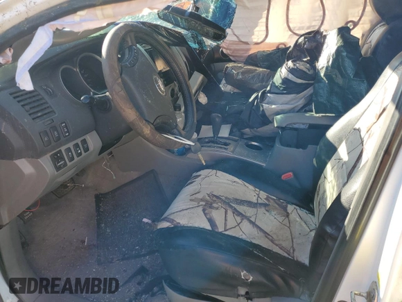 2009 Toyota Tacoma with VIN 3TMLU42N49M038021, listed as a Copart auction lot 46550315 with 103,531 mi miles and Salvage Title. Bid and sale history available at DreamBid. Image 7.