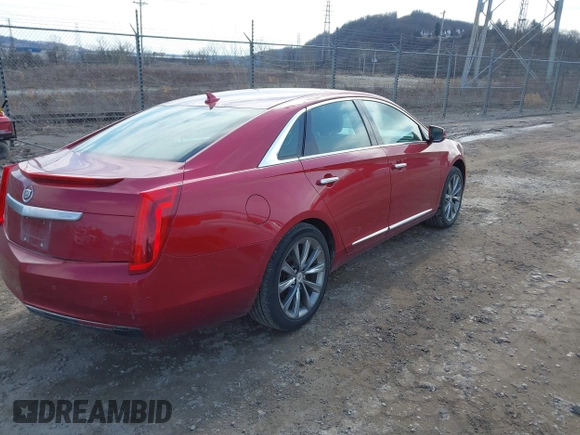 2013 Cadillac XTS z VIN 2G61N5S37D9177217, wystawiony jako IAAI lot #41747566 z przebiegiem 140 946 mil mil oraz . Historia ofert i sprzedaży dostępna na DreamBid. Obrazek 4.
