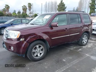 2009 Honda Pilot Touring with VIN 5FNYF48959B007813, listed as a IAAI auction lot 41823645 with 200,571 mi miles and . Bid and sale history available at carsss.com. Image 2.