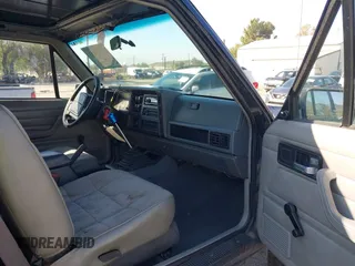 1996 Jeep Cherokee with VIN 1J4FT27S2TL156171, listed as a IAAI auction lot 41578009 with 161,095 mi miles and . Bid and sale history available at DreamBid. Image 5.