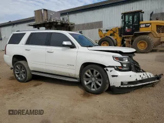 2015 Chevrolet Tahoe LTZ with VIN 1GNSKCKC1FR310018, listed as a Copart auction lot 71798454 with 244,179 mi miles and Salvage title. Bid and sale history available at DreamBid. Image 4.