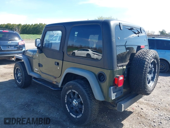 2006 Jeep Wrangler SE with VIN 1J4FA29116P763914, listed as a IAAI auction lot 42140140 with 107,161 mi miles. Bid and sale history available at carsss.com. Image 3.