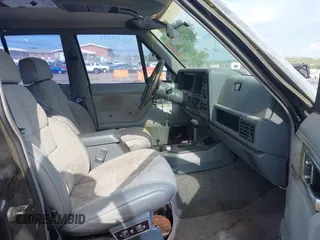 1991 Jeep Cherokee z VIN 1J4FJ58S6ML572036, wystawiony jako IAAI lot #42659999 z przebiegiem 200 845 mil mil oraz . Historia ofert i sprzedaży dostępna na DreamBid. Obrazek 5.