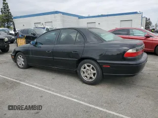 1997 Cadillac Catera z VIN W06VR52RXVR092016, wystawiony jako Copart lot #54067575 z przebiegiem 63 978 mil mil oraz Tytuł czysty. Historia ofert i sprzedaży dostępna na DreamBid. Obrazek 2.