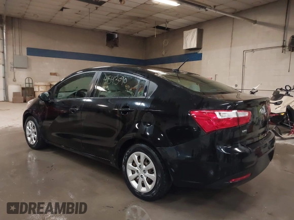 2014 Kia Rio LX with VIN KNADM4A31E6404206, listed as a IAAI auction lot 41543090 with 70,563 mi miles and . Bid and sale history available at DreamBid. Image 3.