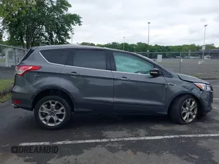 2013 Ford Escape SEL z VIN 1FMCU9H96DUC66206, wystawiony jako IAAI lot #42376442 z przebiegiem 96 776 mil mil oraz . Historia ofert i sprzedaży dostępna na DreamBid. Obrazek 13.