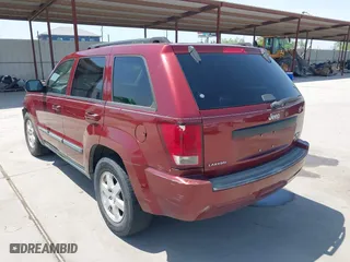 2009 Jeep Grand Cherokee Laredo with VIN 1J8GS48K39C521160, listed as a IAAI auction lot 42039577 with 262,829 mi miles. Bid and sale history available at carsss.com. Image 3.